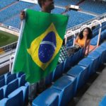 Aluno com a bandeira do Brasil