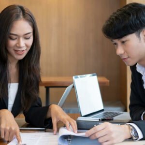 Two foreign boys communicate in an office