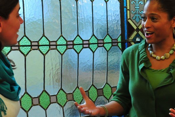 Two foreign girls share a conversation